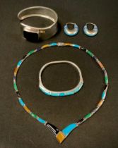 A Mexican 950 silver multi gem necklace set with tigers eye, Turquoise. lapis lazuli, black onyx and