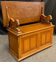 A mid century oak Monk’s Bench, 100cm (74cm) high x 106cm wide x 44cm deep. Replacement fixings