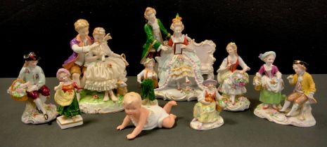 A pair of Sitzendorf porcelain figures, seated flower seller and companion, others Children, Dandy