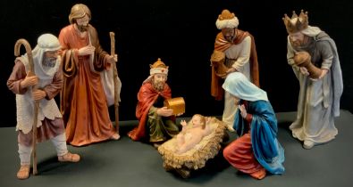 A seven piece Holyart Nativity figure set, Jesus in the manger, Joseph, Mary, three kings etc,