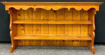 A pine wall mounted dresser top, as a two-tier kitchen shelf, 63.5cm high x 114.5cm wide x 27.5cm.