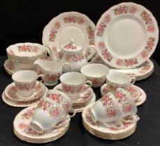 A Colough part table service for six including; six dinner plates, five smaller, tea pot; etc