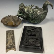 A Japanese carved ink stone, 17cm x 11.5cm; a reproduction Japanese bronze Dragon-fish kettle, 15.