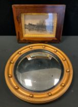 A late 19th/early 20th century rosewood frame, framing a etching ; a Regency style convex mirror (2)