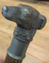 A 20th century dogs head walking stick, cast metal handle as a Terrier, tapering shaft, 89.5cm long