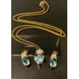 A diamond and blue topaz pendant necklace and earring suite, 9ct gold mounts, stamped 375, 6.3g