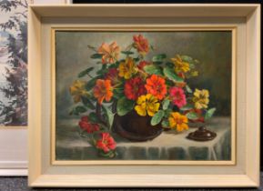 Constance M Cooper (1905-1988), Nasturtiums in a brown glazed teapot, signed, oil on canvas, 29cm