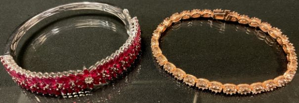 A Malagasy Ruby and white zircon sterling silver bangle, 16.75ct Malagasy Rubies, 0.100 white