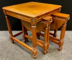 A walnut occasional table, with nested pair of collapsible circular topped tables or stools, 53cm