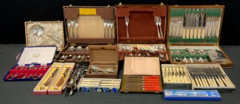 A quantity of flatware including canteen services, sets of spoons, tea spoons, carving sets; etc