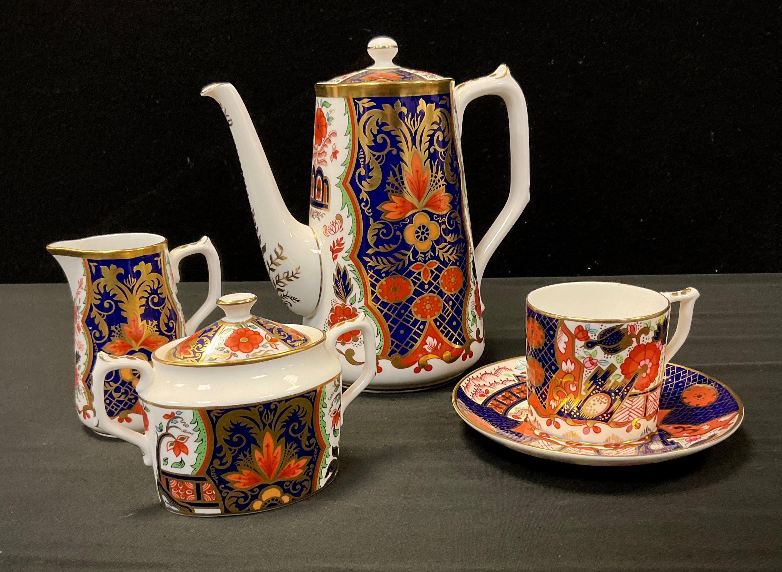 A Royal Crown Derby ‘ Rich Japan Pardoe’ pattern three piece coffee set, conforming coffee can and