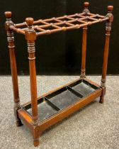 A Victorian mahogany stick stand / umbrella stand, turned supports, metal tray inset to base, 71cm