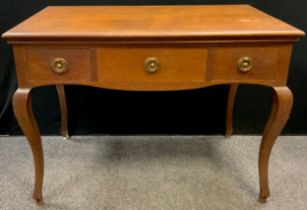 An early 20th century oak low boy, three drawers to frieze, cabriole legs, 79cm high x 106.5cm