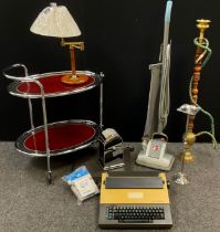 A 1970’s chromed metal and glass tea trolley; adjustable table lamp; Brother electronic