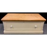A large oak and pine single drawer chest / coffee table, the base painted white, (converted from the