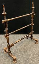 A late 19th/early 20th century tapestry/embroidery stand, adjustable arms, turned columns, stretcher