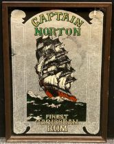 Advertising - a Captain Norton Finest Caribbean Rum wall mirror, 86cm x 60.5cm overall frame size.