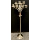 A floor standing polished chrome twelve branch candelabrum, tealight holder, 110cm high, 45cm