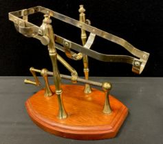 A mechanical action wine bottle decanting cradle, 20th century.