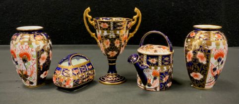 Royal Crown Derby - pair of miniature 6299 pattern vases, twin handle trophy cup, basket potpourri