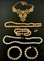 Jewellery - a freshwater cultured pearl necklace and similar bracelet suit, with pink irregular