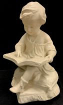 A 20th century cast plaster figure of little girl reading her book, 33cm high