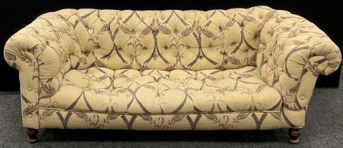 A Chesterfield sofa, deep button-back, fabric upholstery, turned legs, 65cm high x 182cm wide x 89cm