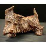 A large earthenware model of a standing Terrier dog, probably by Alice Teichner for Bourne Denby,