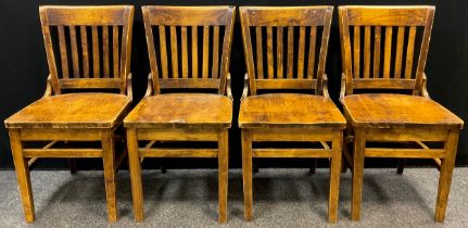 A set of four mid century style hardwood chairs, each measuring 87cm high x 45cm wide x 47cm