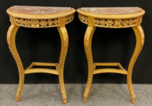 A pair of Louis xiv gilt-wood style demi-lune side tables, rouge marble semi-circular inset tops,