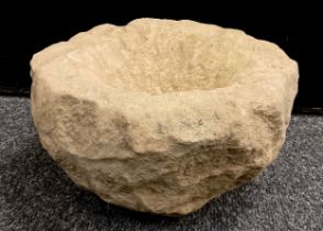A Derbyshire stone crucible shaped bowl, trough, 16cm high x 29cm.