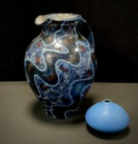 Studio Pottery - A Robert Goldsmith water jug, in tones of blue, black, and red glaze, 32cm high,