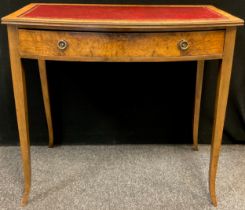 A George III style Burr Walnut veneered hall table, bow front, inset red faux-leather writing