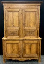 A 19th century French Pine Buffet Deux Corps / dresser, the top section with carved lower panels