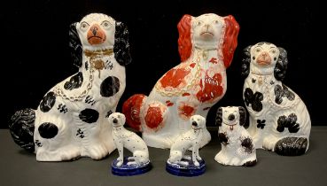 A 19th century Staffordshire pottery figure Spaniel, others dalmations etc, assorted sizes, 32cm