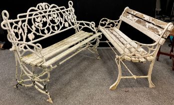 An early to mid 20th century cast iron garden bench, the back and sides cast as entwined fruiting