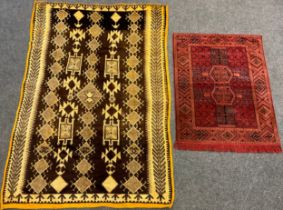 A North African hand-knotted rug, in tones of brown and cream, narrow ochre yellow coloured