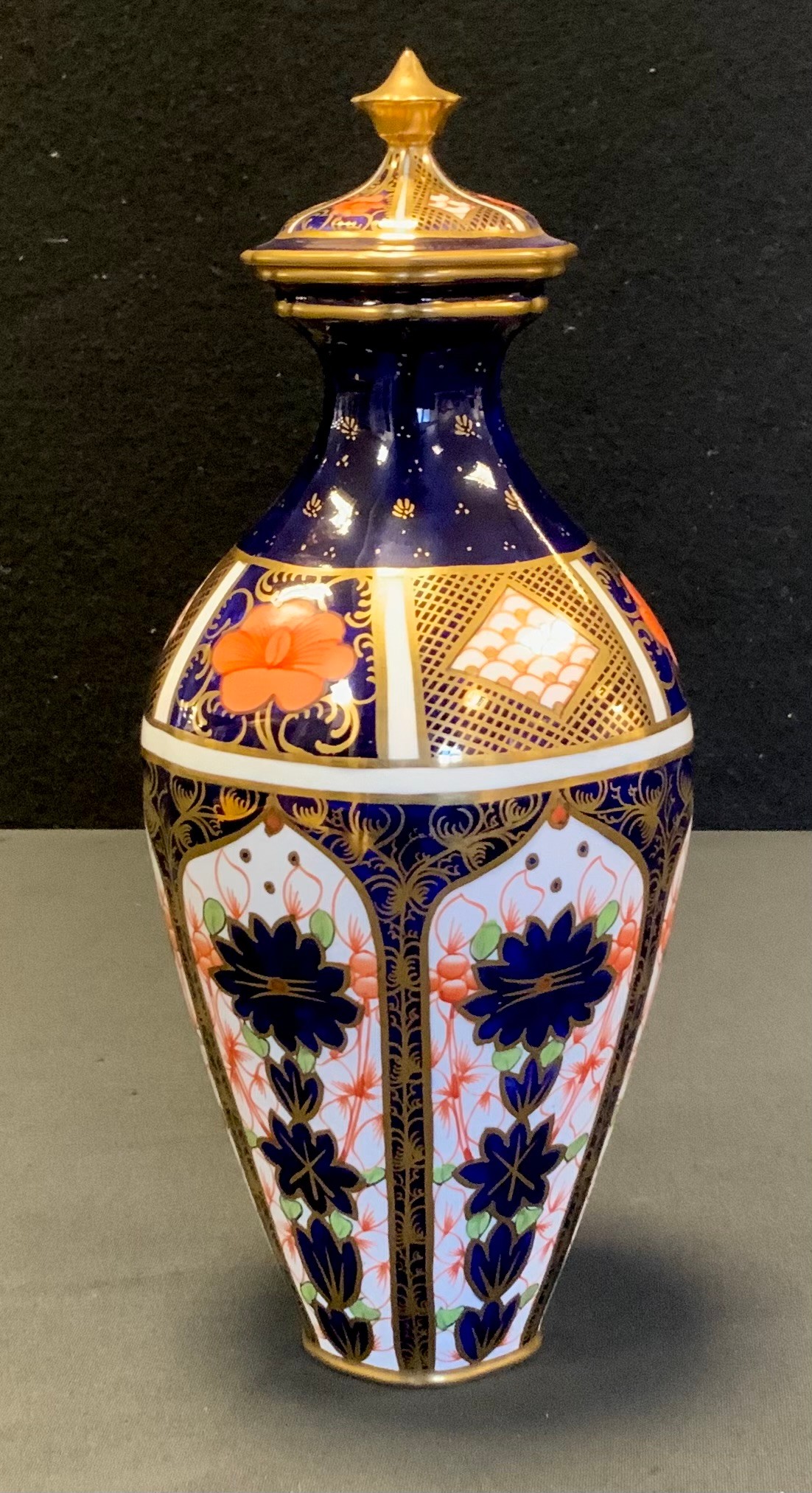 A Royal Crown Derby 1128 Imari pattern urn and cover, rounded hexagonal base, date code for 1920,