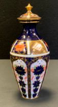 A Royal Crown Derby 1128 Imari pattern urn and cover, rounded hexagonal base, date code for 1920,