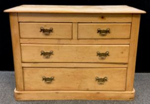 A Victorian pine chest of drawers, over-sailing rounded rectangular top, above a pair of short,