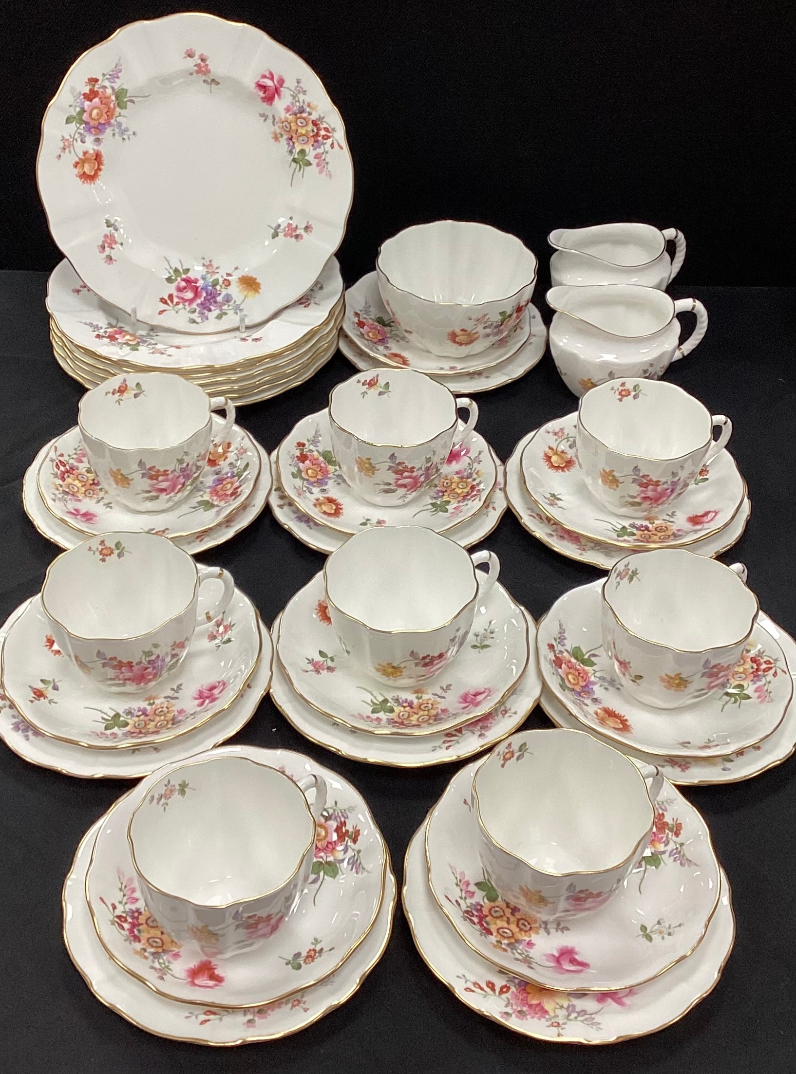 A Royal Crown Derby part tea service for eight including eight tea cups and saucers , milk jugs; etc