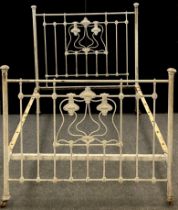 A Victorian painted cast iron and brass Art Nouveau double bed frame, 148.5cm high at headboard,