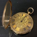 A Continental yellow metal cased open face pocket watch, gilt floral dial, Roman numerals, key
