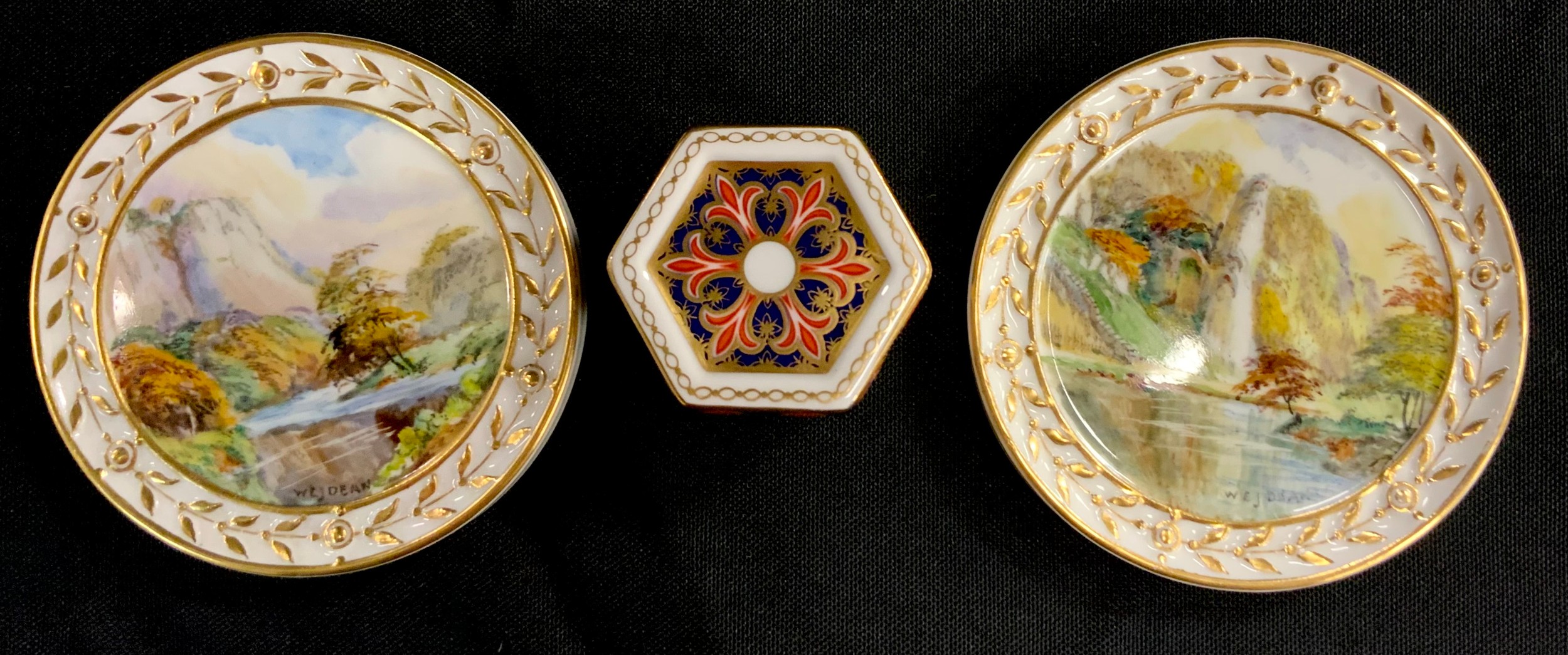 A pair of Royal Crown Derby hand painted circular plaques, ‘ High Tor Matlock’, ‘ Tissington