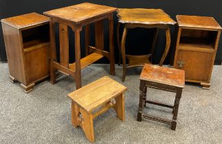 An Arts and Crafts oak side table, rectangular over-sailing top, pierced supports, 73cm high x