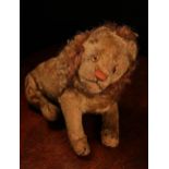 An early 20th century jointed golden mohair Lion, attributed to Steiff (Germany), amber and black