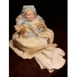 A German bisque head and jointed painted composition bodied character baby doll, attributed to