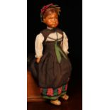 An early 20th century Swiss carved wooden head doll, probably produced in the Brienz Region by