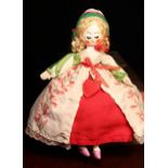 A reproduction 'Queen Anne' style carved and painted wooden artist doll, the carved and painted head