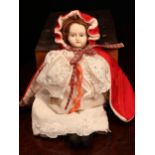 A bisque shoulder head doll, the bisque shoulder head with painted features including brown